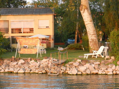 In Szántód a half of a semi-detached house on the waterfront is for rent for max 4+1   people